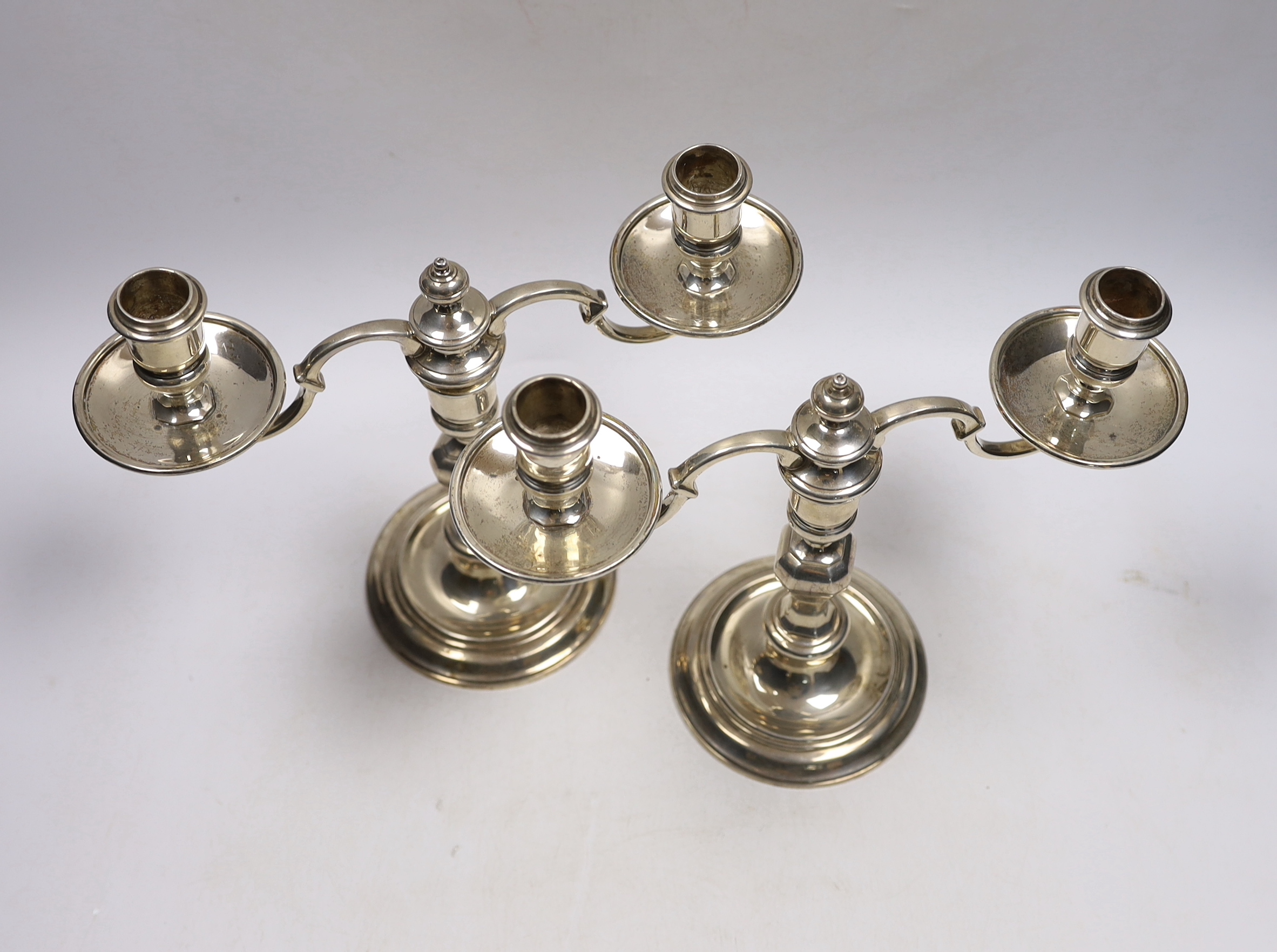 A pair of George VI silver two branch, two light candelabra, Thomas Ducrow & Sons, Birmingham, 1945, height 20.8cm, 44.6oz.